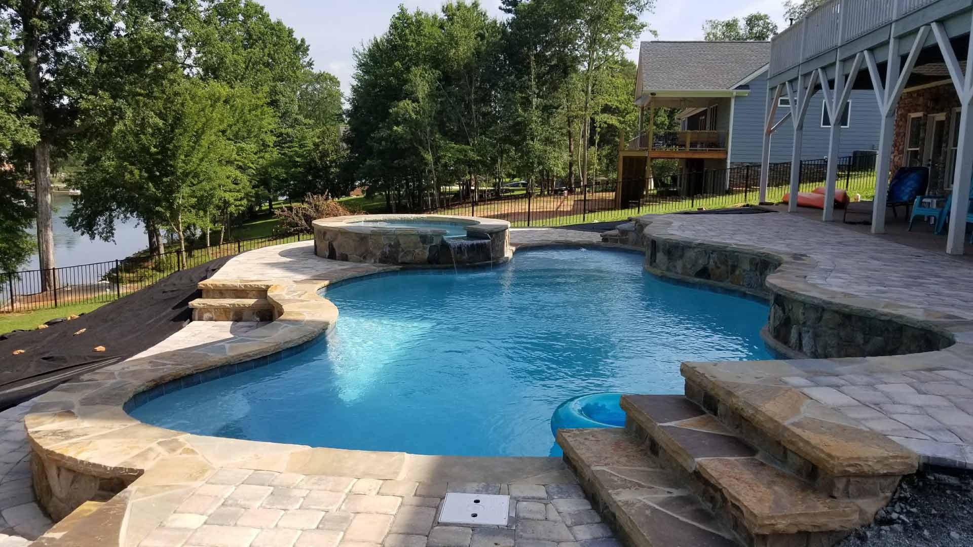Finished custom poolscape with decking and landscaping